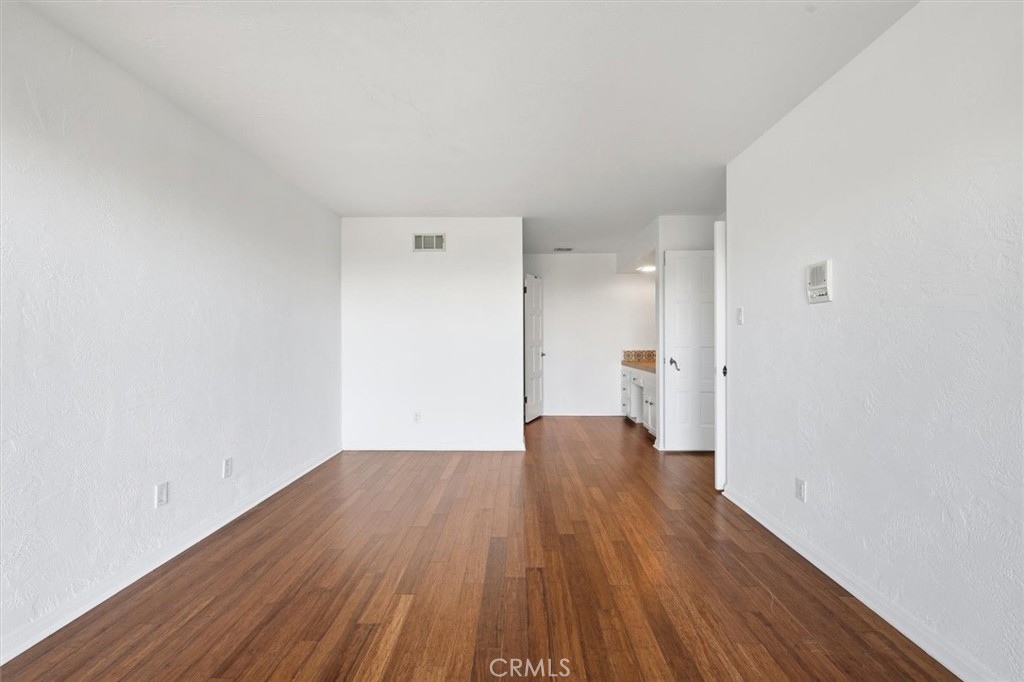 1308 Vía Coronel Palos Verdes Estates, CA 90274 - Photo 46 of 74 a view of a big room with wooden floor and windows