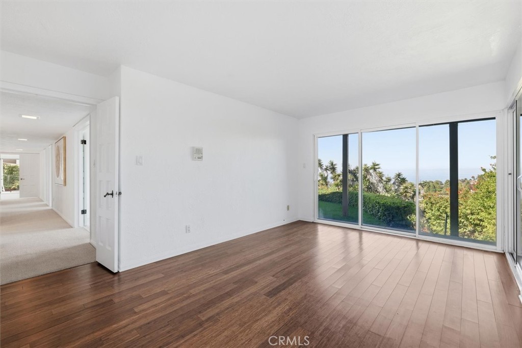 1308 Vía Coronel Palos Verdes Estates, CA 90274 - Photo 48 of 74 wooden floor in an empty room with a window