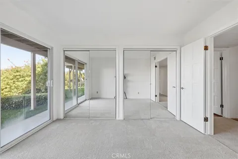 a view of a house with a yard and plants