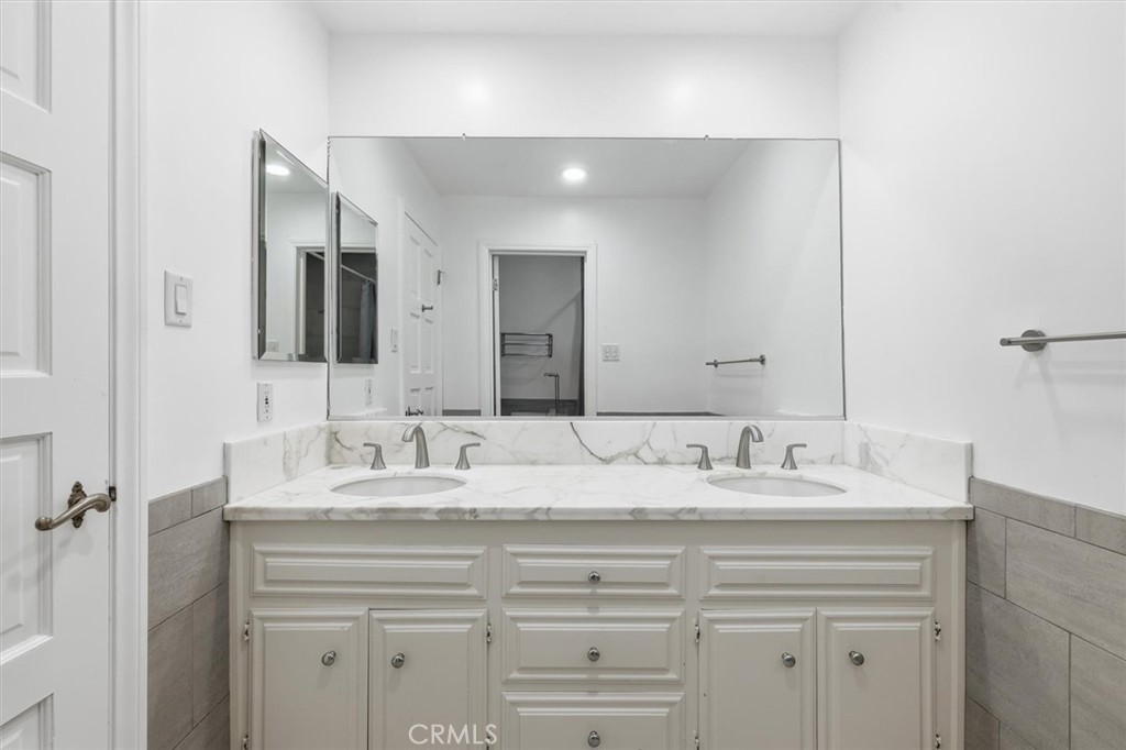 1308 Vía Coronel Palos Verdes Estates, CA 90274 - Photo 52 of 74 a bathroom with a sink vanity and mirror