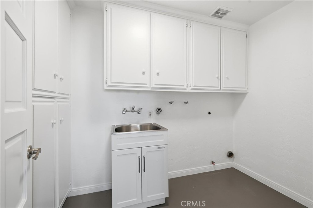 1308 Vía Coronel Palos Verdes Estates, CA 90274 - Photo 63 of 74 a bathroom with a sink and cabinets