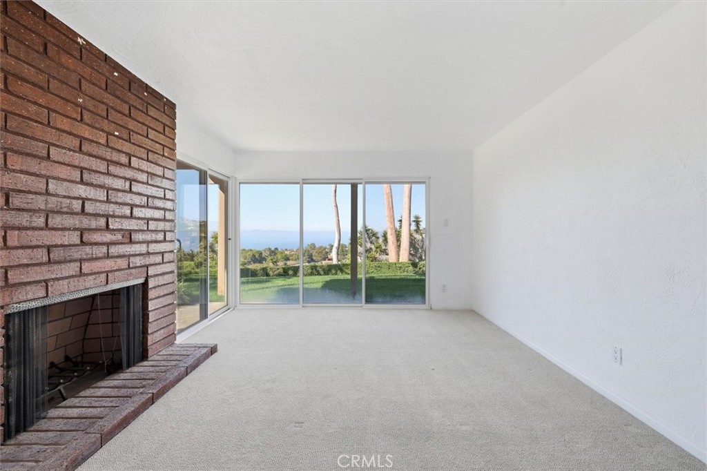 1308 Vía Coronel Palos Verdes Estates, CA 90274 - Photo 64 of 74 a view of an empty room with a fireplace and a window