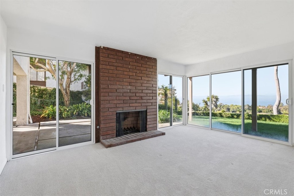 1308 Vía Coronel Palos Verdes Estates, CA 90274 - Photo 65 of 74 a view of an empty room with a fireplace and a window