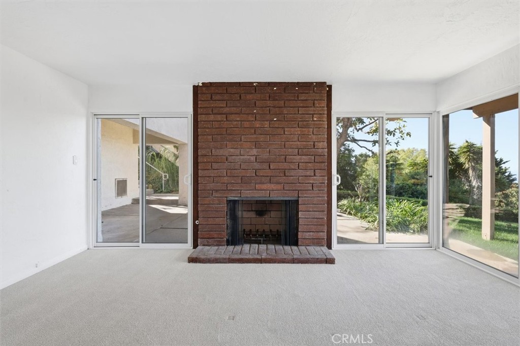 1308 Vía Coronel Palos Verdes Estates, CA 90274 - Photo 66 of 74 a living room with furniture and a fireplace