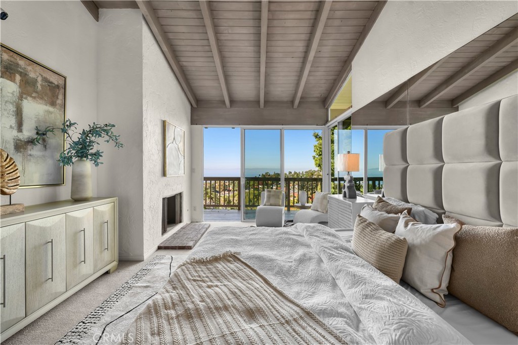 1308 Vía Coronel Palos Verdes Estates, CA 90274 - Photo 7 of 74 a large bedroom with a large bed and a large window
