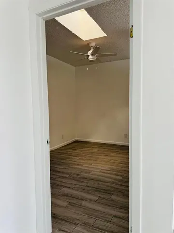 a view of room with wooden floor