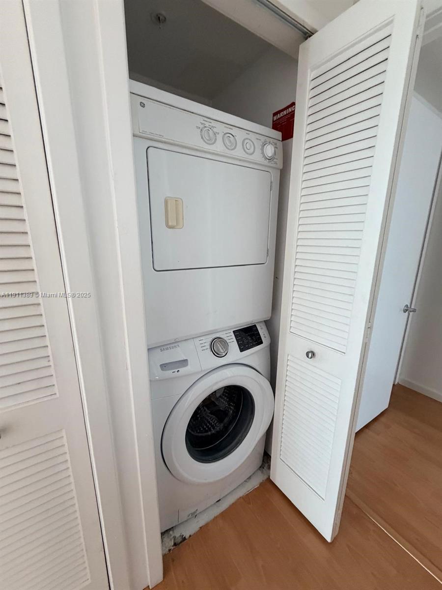 218 Southeast 14th Street, Unit 2102 Miami, FL 33131 - Photo 12 of 19 a utility room with dryer and washer