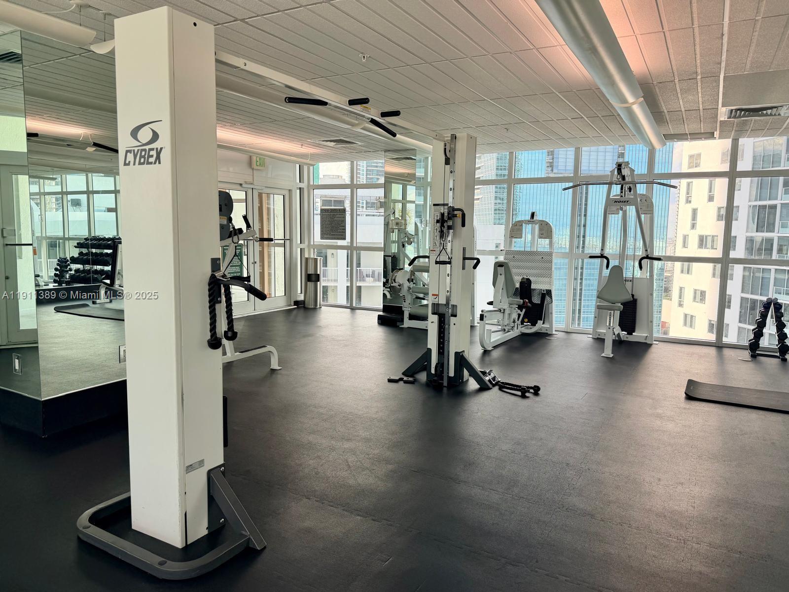 218 Southeast 14th Street, Unit 2102 Miami, FL 33131 - Photo 16 of 19 a view of a room with gym equipment