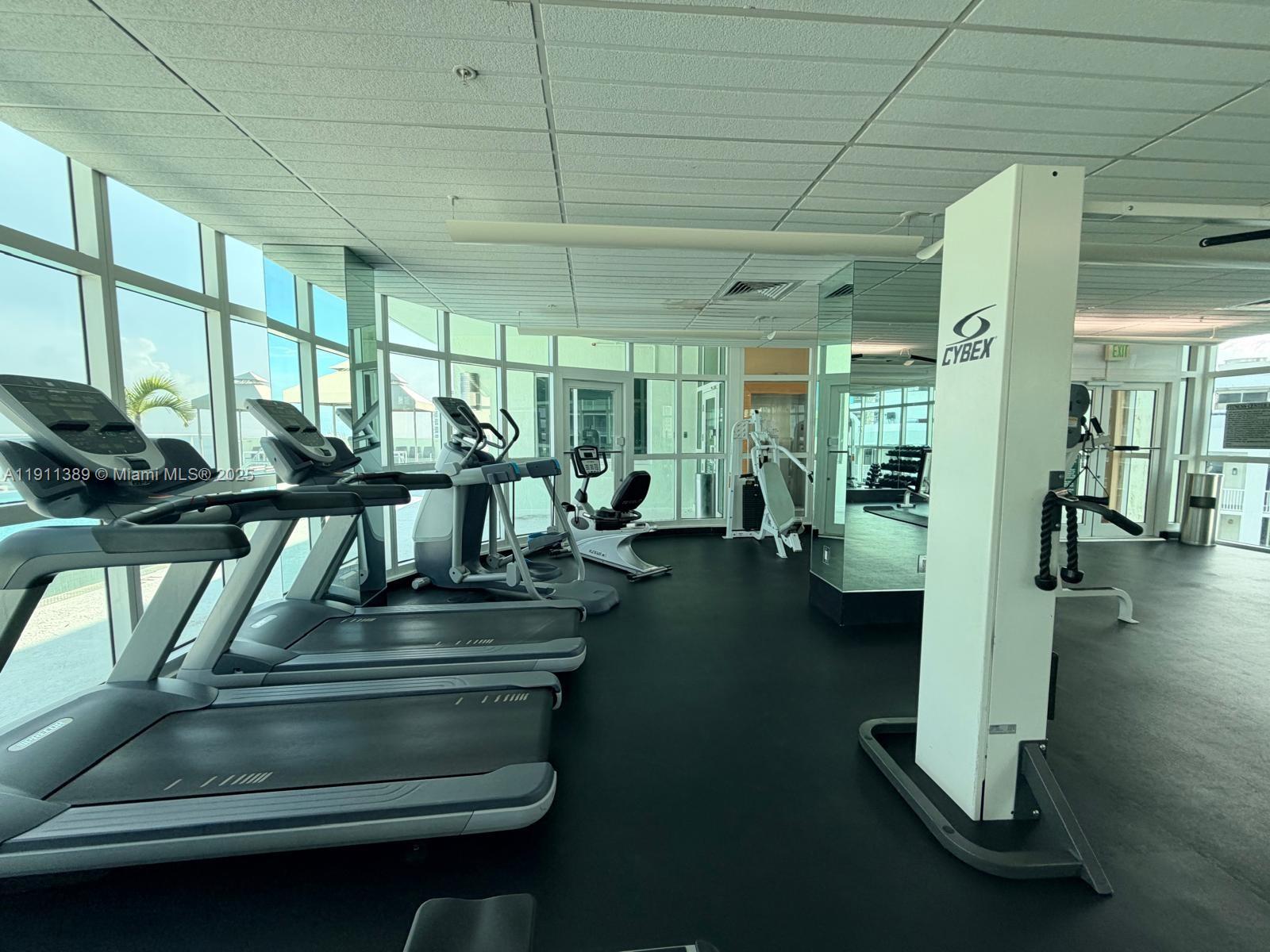 218 Southeast 14th Street, Unit 2102 Miami, FL 33131 - Photo 17 of 19 a gym hall with exercise machine
