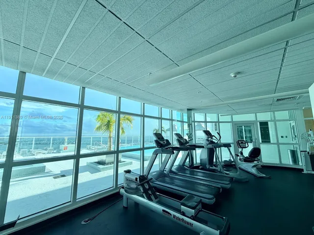 a view of a patio with table and chairs