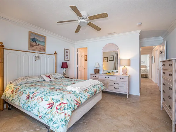 a bed room with a bed and a chandelier