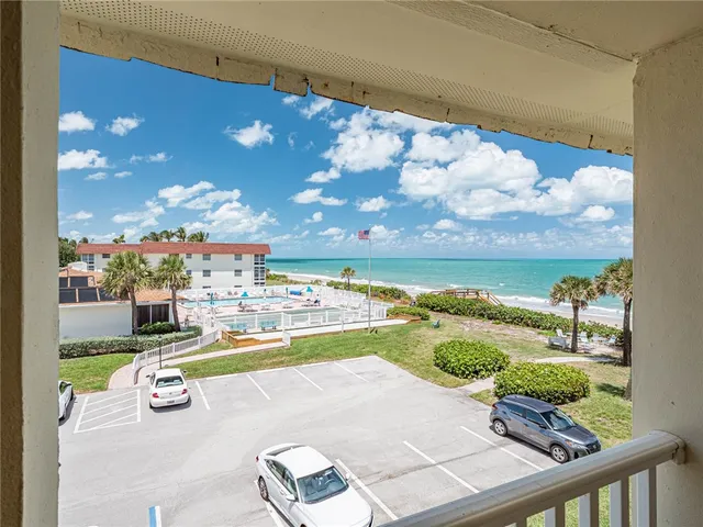 a view of a swimming pool with a lounge chair
