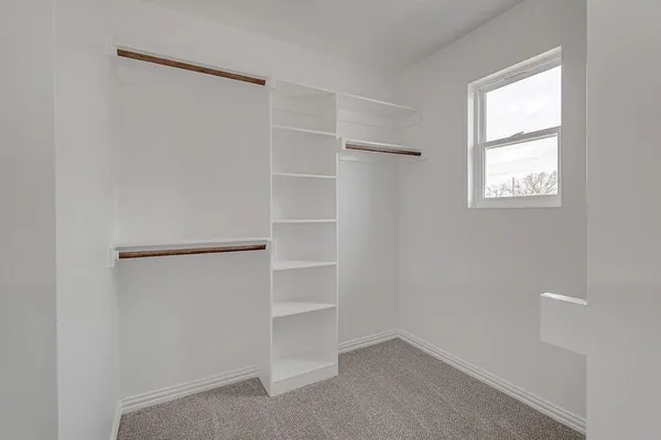 a view of an empty walk in closet