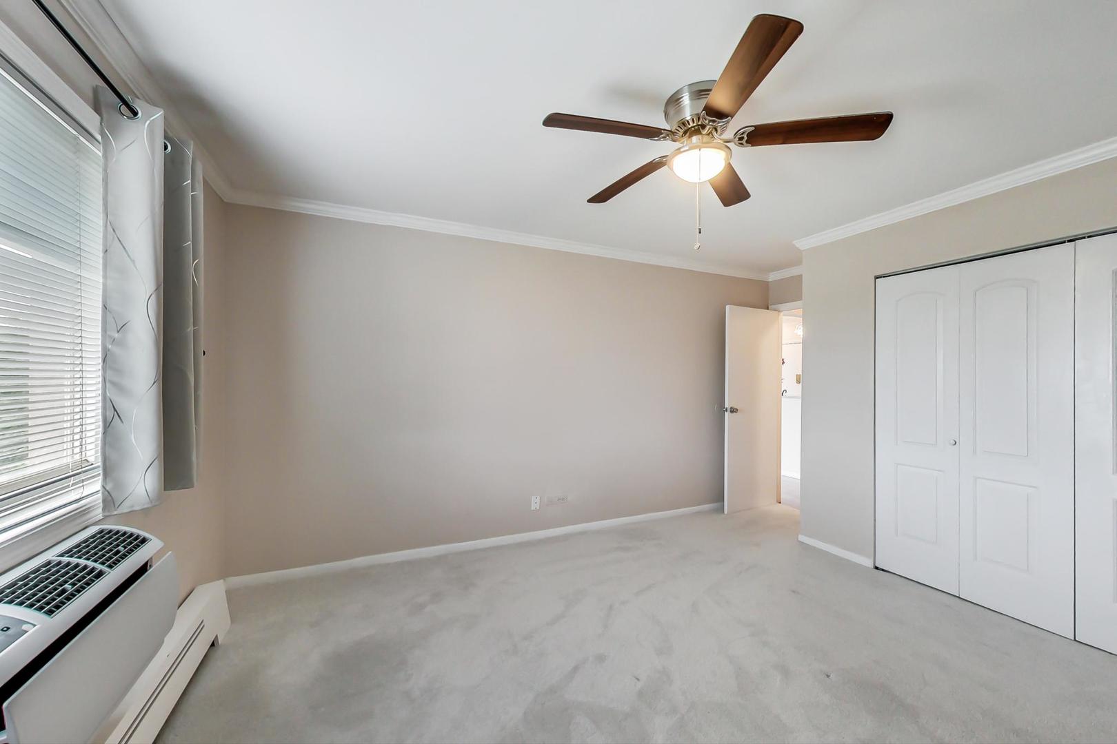 2234 South Goebbert Road, Unit 425 Arlington Heights, IL 60005 - Photo 11 of 20 a view of an empty room with a window