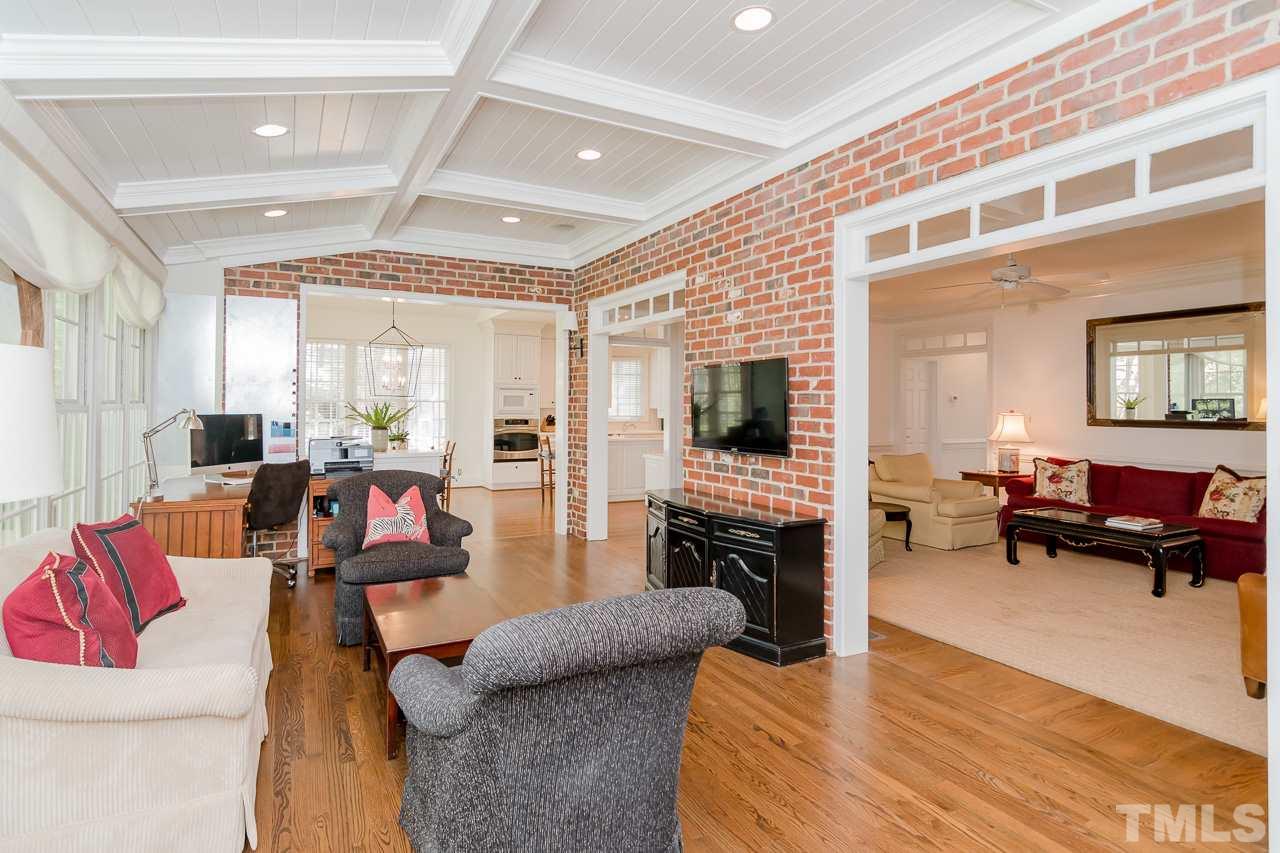 407 Forsyth Street Raleigh, NC 27609 - Photo 11 of 30 a living room with furniture and a flat screen tv