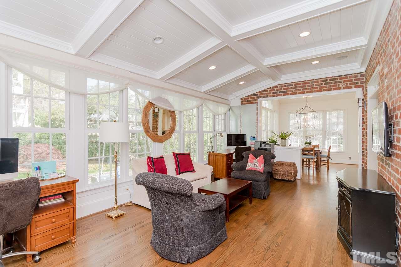 407 Forsyth Street Raleigh, NC 27609 - Photo 12 of 30 a living room with furniture and a flat screen tv