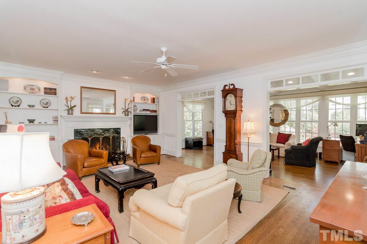 407 Forsyth Street Raleigh, NC 27609 - Photo 16 of 30 a living room with fireplace furniture and a large window