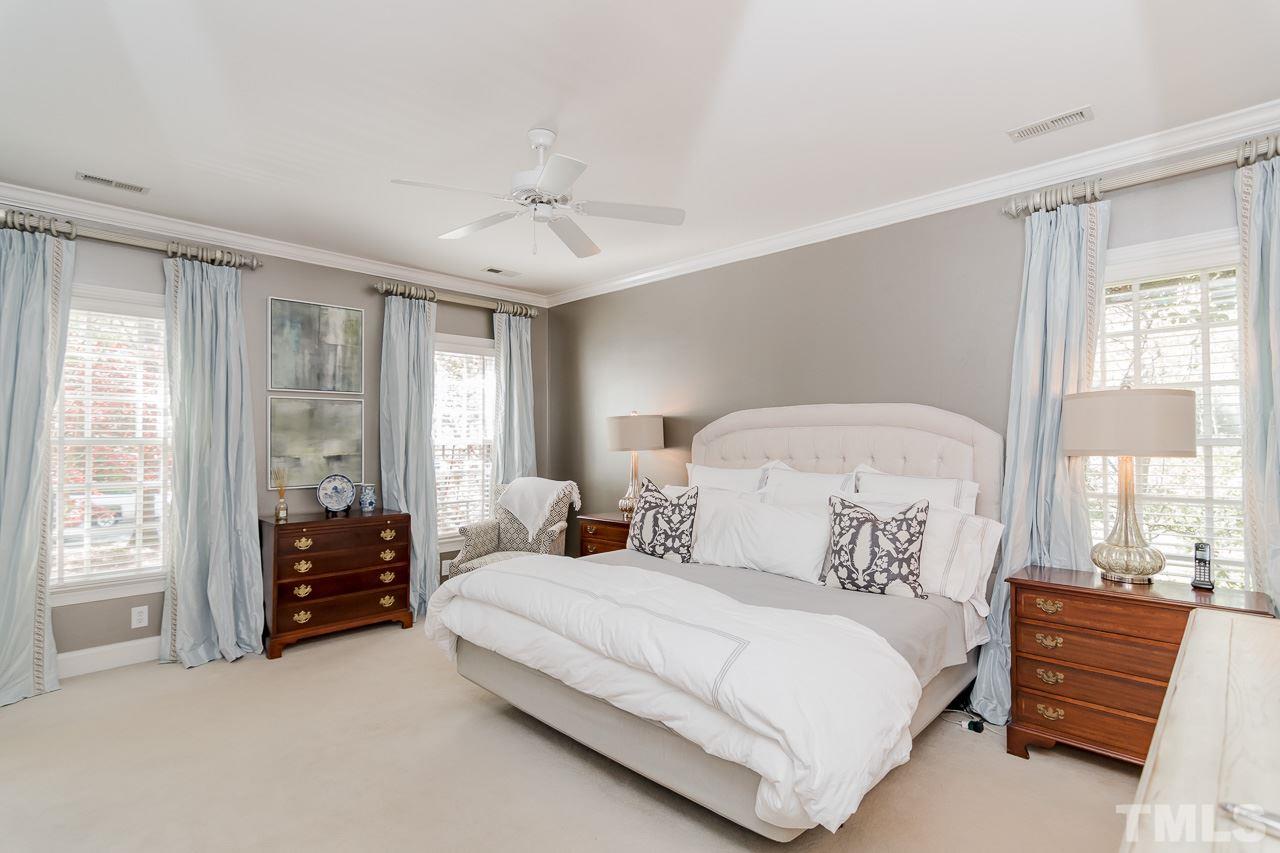 407 Forsyth Street Raleigh, NC 27609 - Photo 18 of 30 a bedroom with a bed and a large window