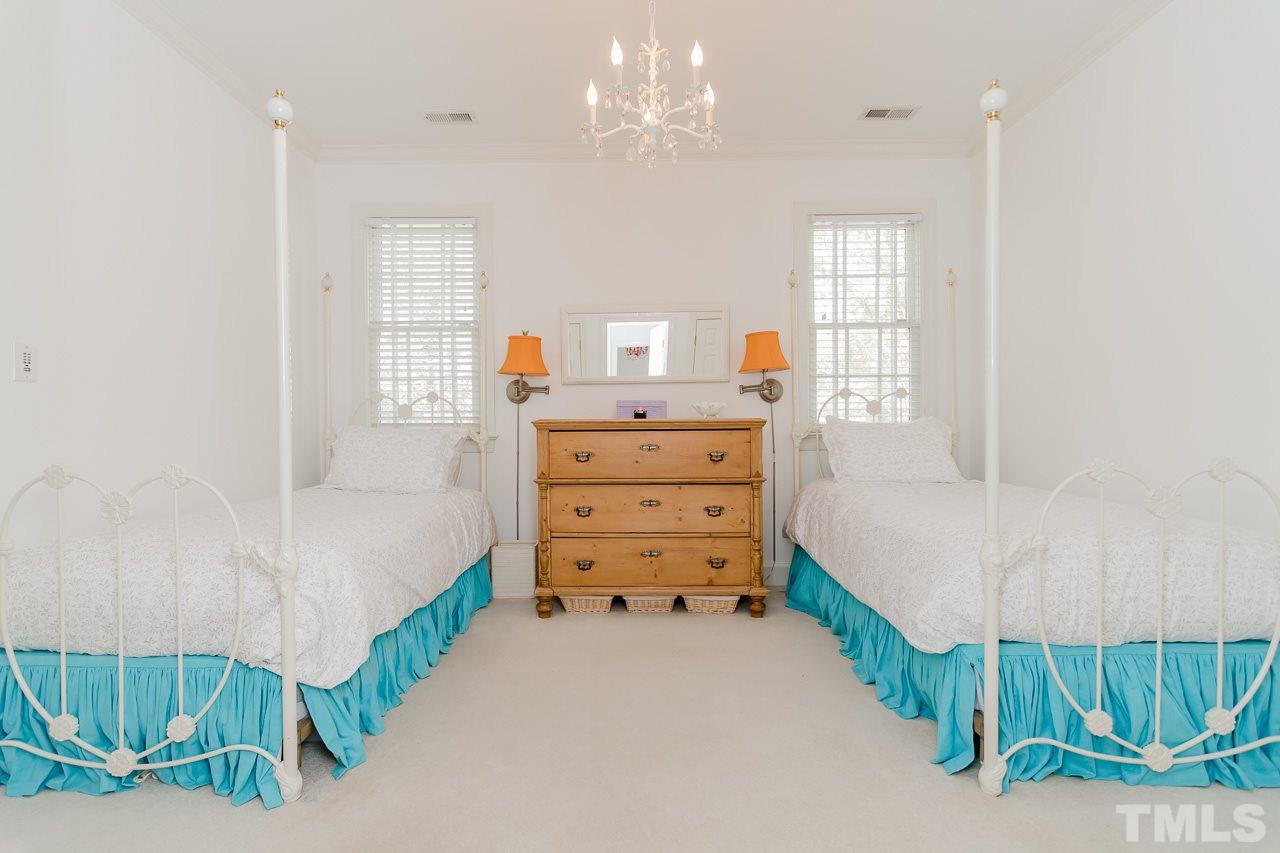 407 Forsyth Street Raleigh, NC 27609 - Photo 21 of 30 a bedroom with a bed and a dresser