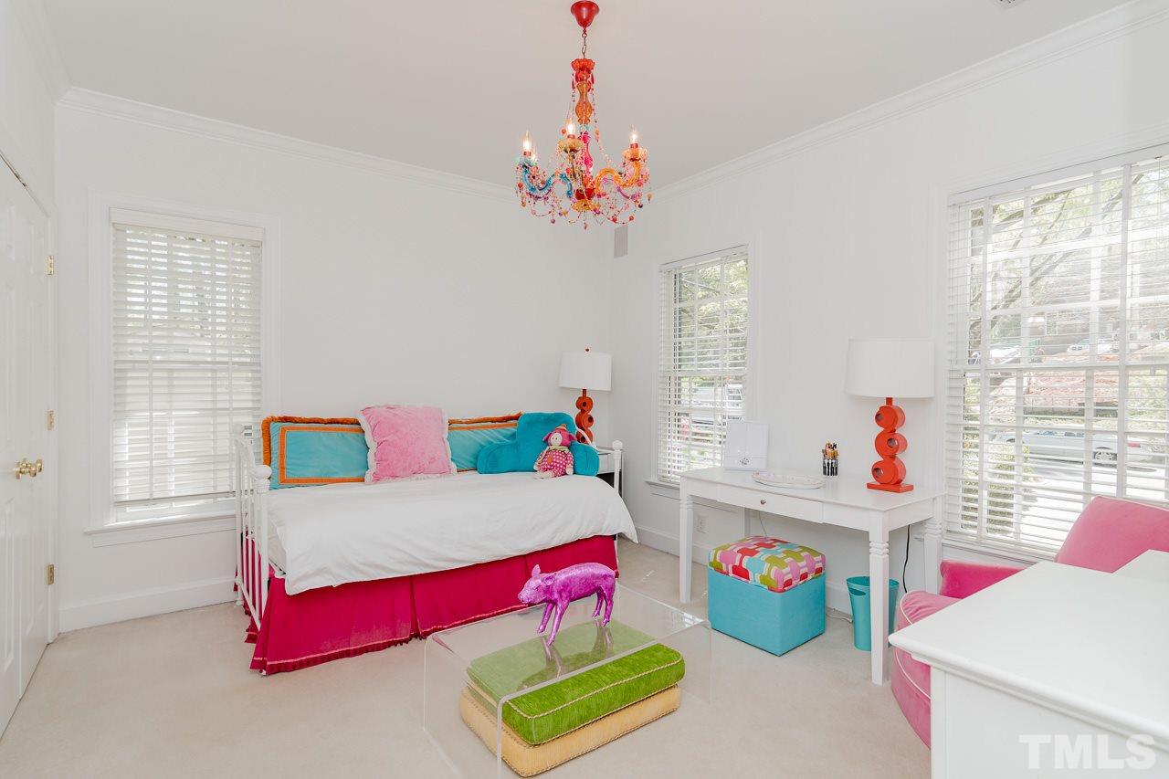 407 Forsyth Street Raleigh, NC 27609 - Photo 23 of 30 a living room with baby toys and a window