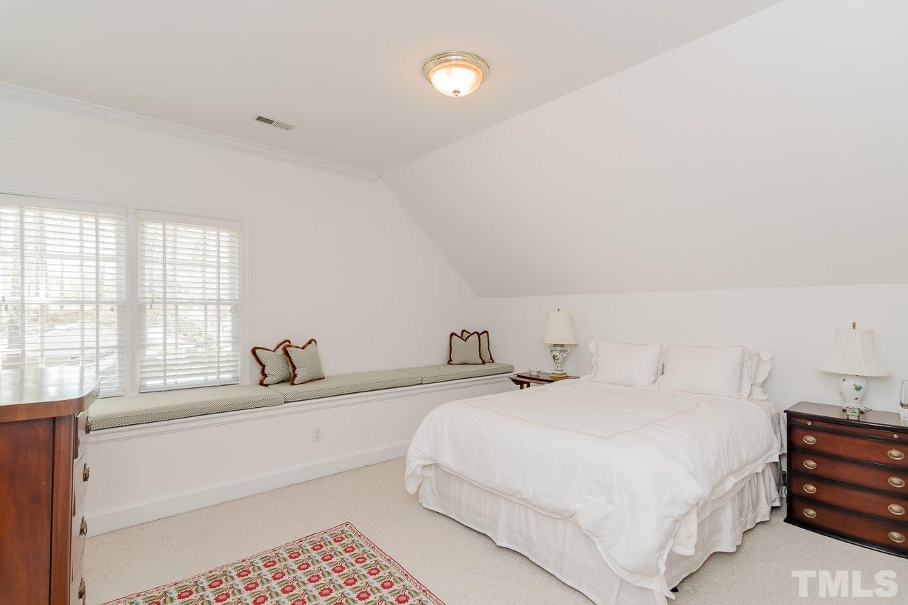 407 Forsyth Street Raleigh, NC 27609 - Photo 26 of 30 a bedroom with a bed and a window