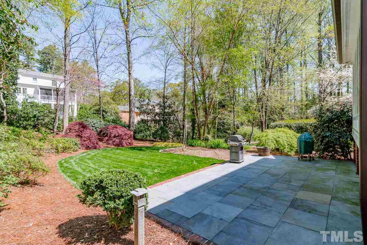 407 Forsyth Street Raleigh, NC 27609 - Photo 29 of 30 a view of a backyard with plants and large trees