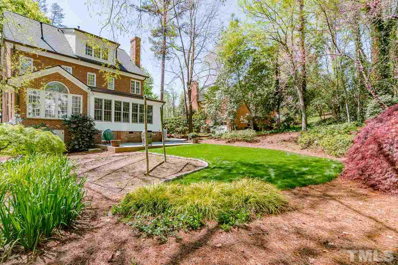 407 Forsyth Street Raleigh, NC 27609 - Photo 30 of 30 a view of a building with a yard and sitting area