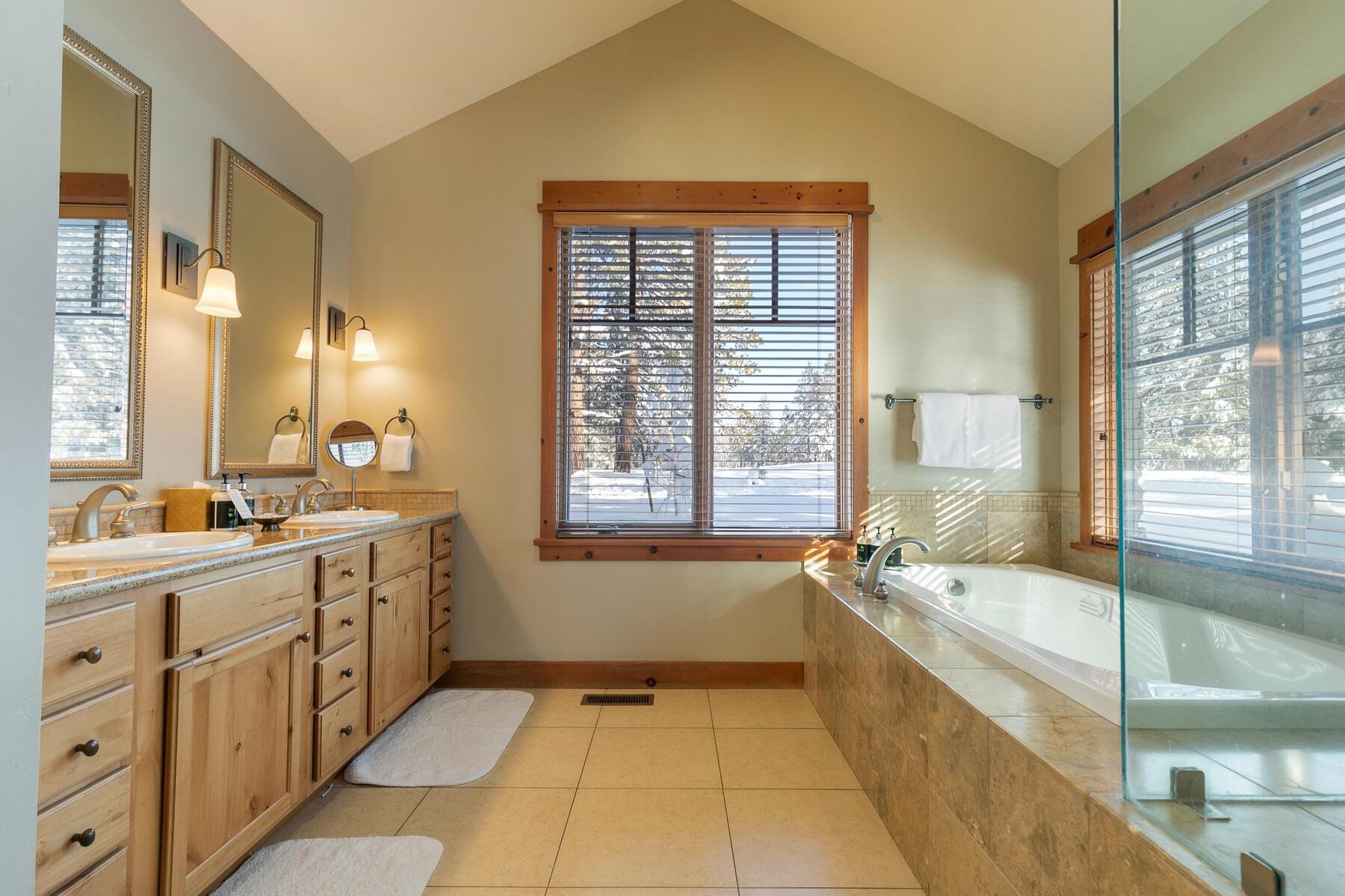 12258 Lookout Loop, Unit F2303 Truckee, CA 96161 - Photo 14 of 27 a spacious bathroom with a tub sink shower and mirror