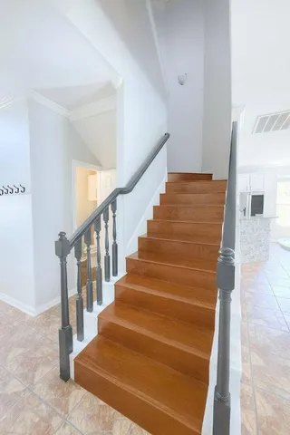 a view of a room with wooden floor