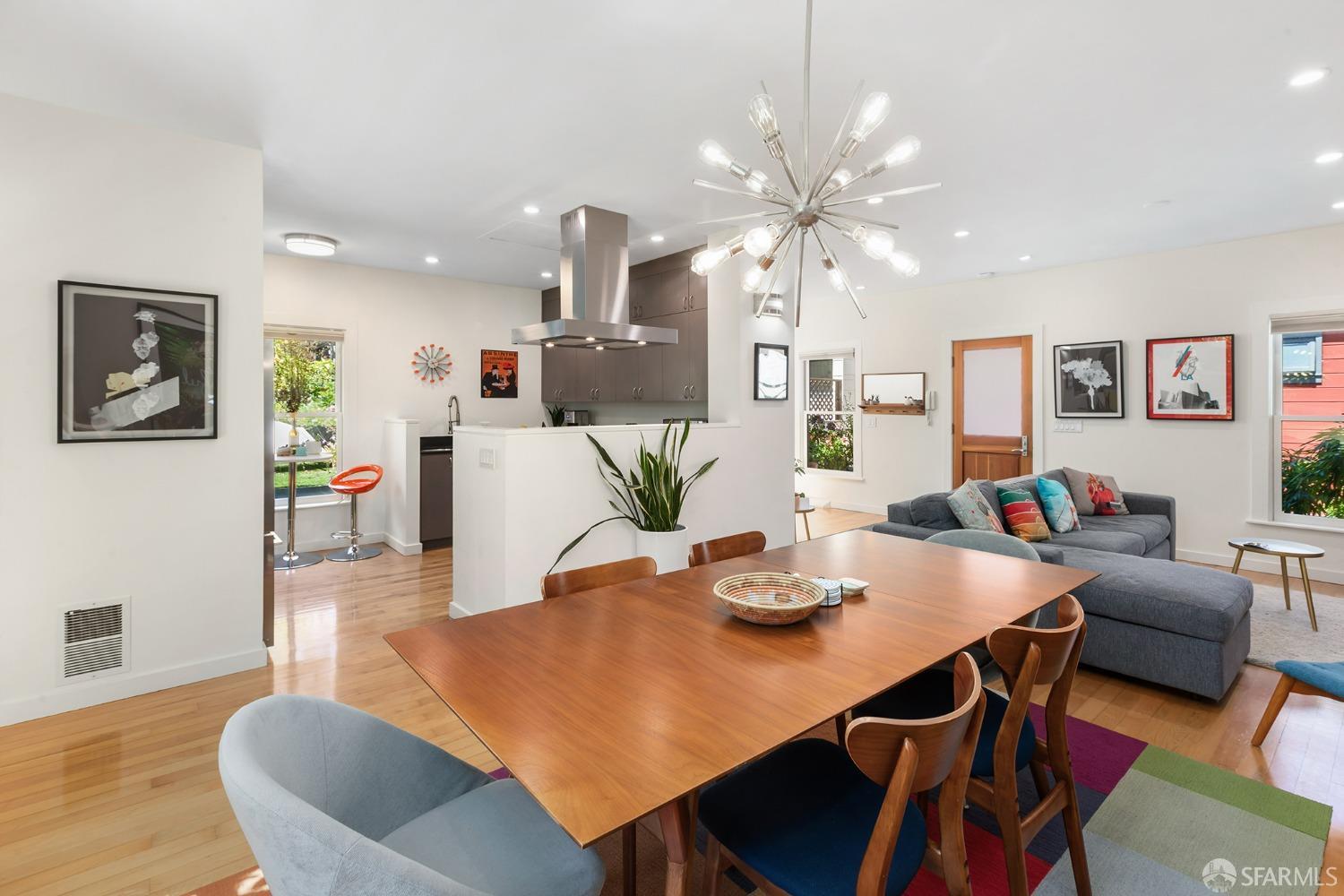328 Harriet Street San Francisco, CA 94103 - Photo 11 of 41 a view of a dining room with furniture and wooden floor