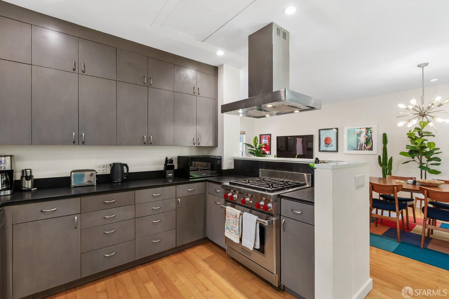328 Harriet Street San Francisco, CA 94103 - Photo 13 of 41 a kitchen with stainless steel appliances granite countertop a sink and cabinets