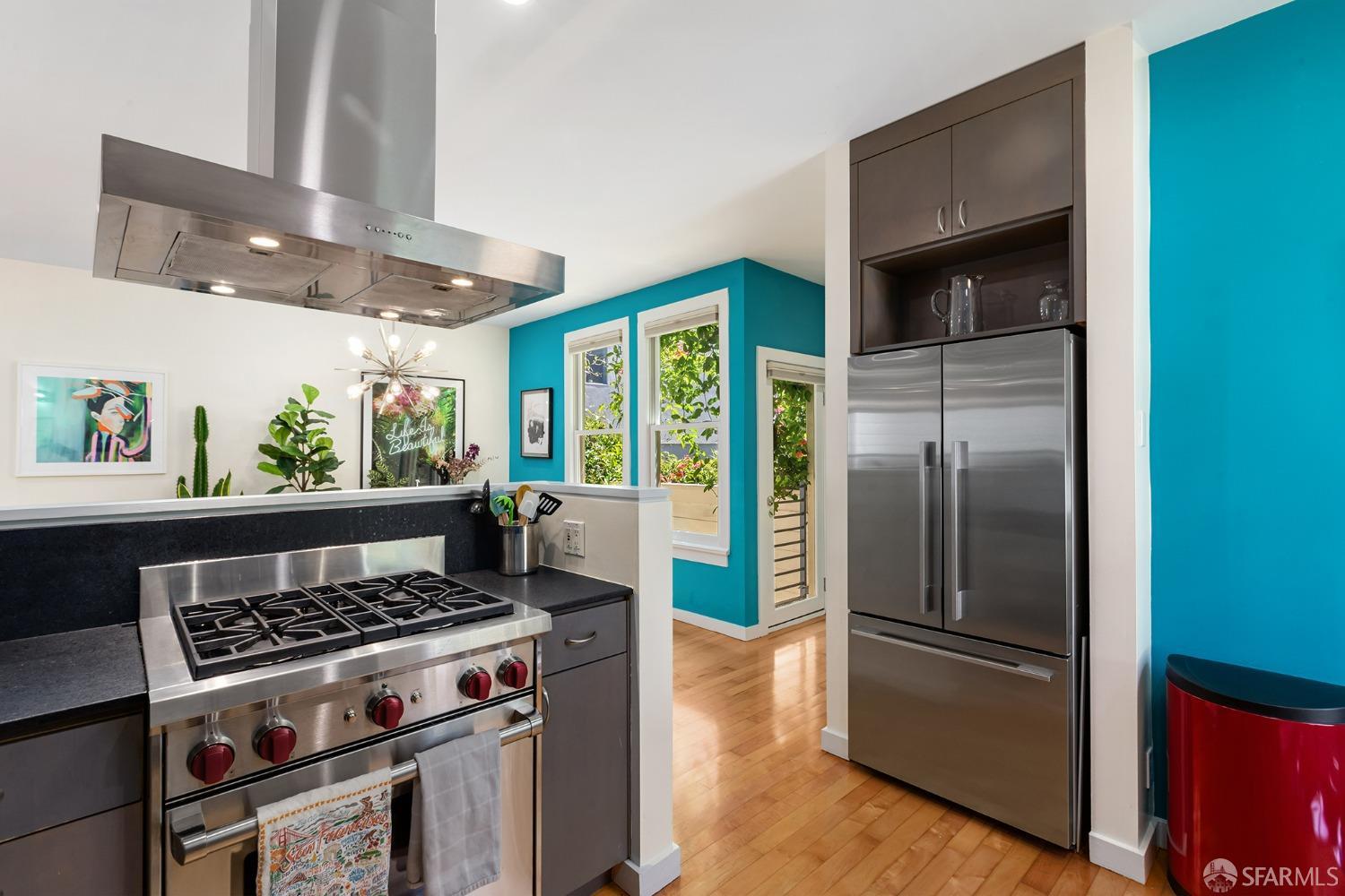 328 Harriet Street San Francisco, CA 94103 - Photo 15 of 41 a kitchen with a stove and a refrigerator