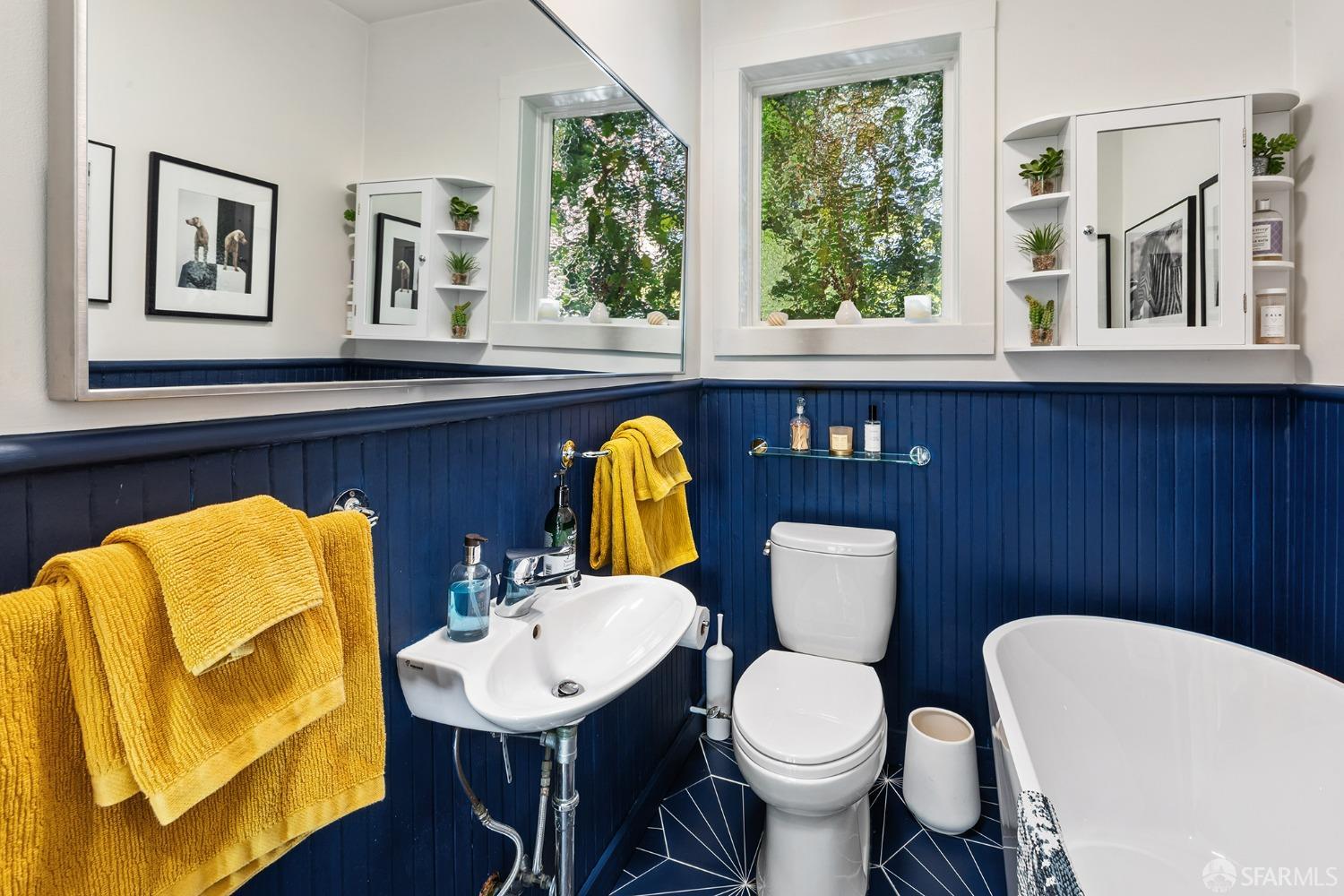 328 Harriet Street San Francisco, CA 94103 - Photo 18 of 41 a bathroom with a toilet sink and mirror