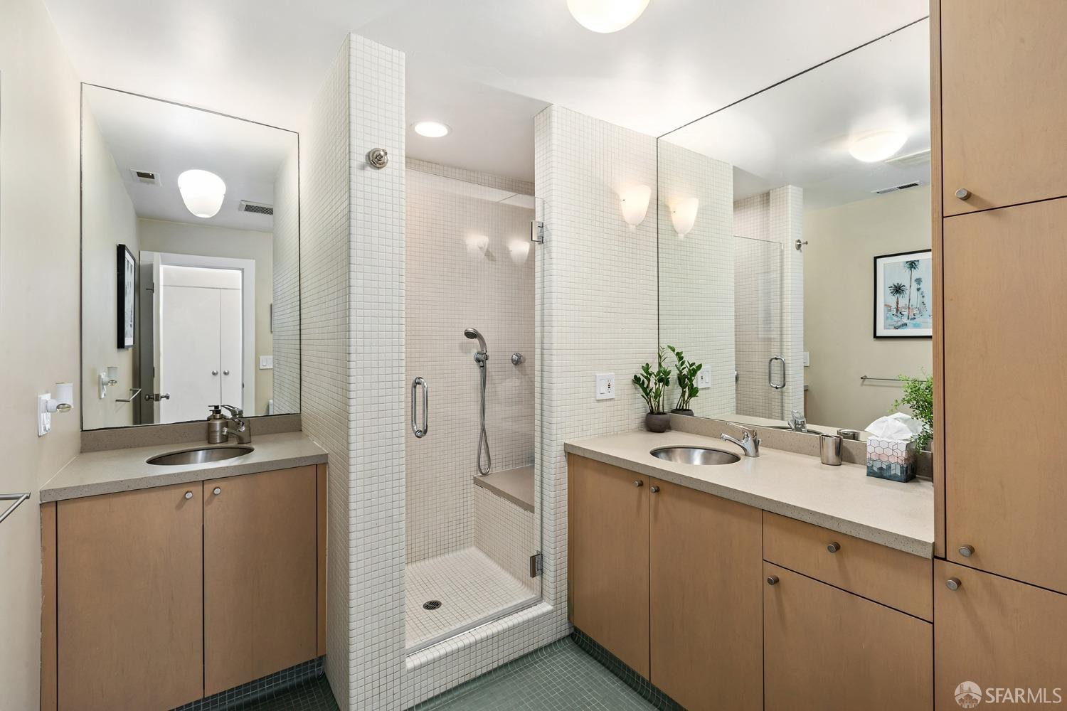 328 Harriet Street San Francisco, CA 94103 - Photo 29 of 41 a bathroom with a sink and a mirror