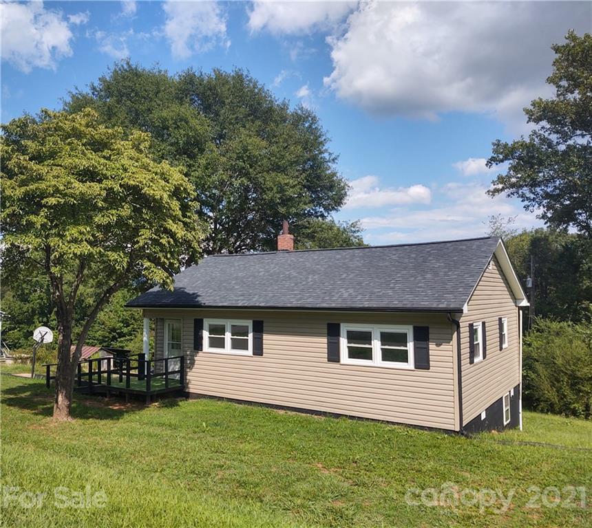 3280 Highway 64 Rutherfordton, NC 28139 - Photo 14 of 15 a front view of a house with a garden