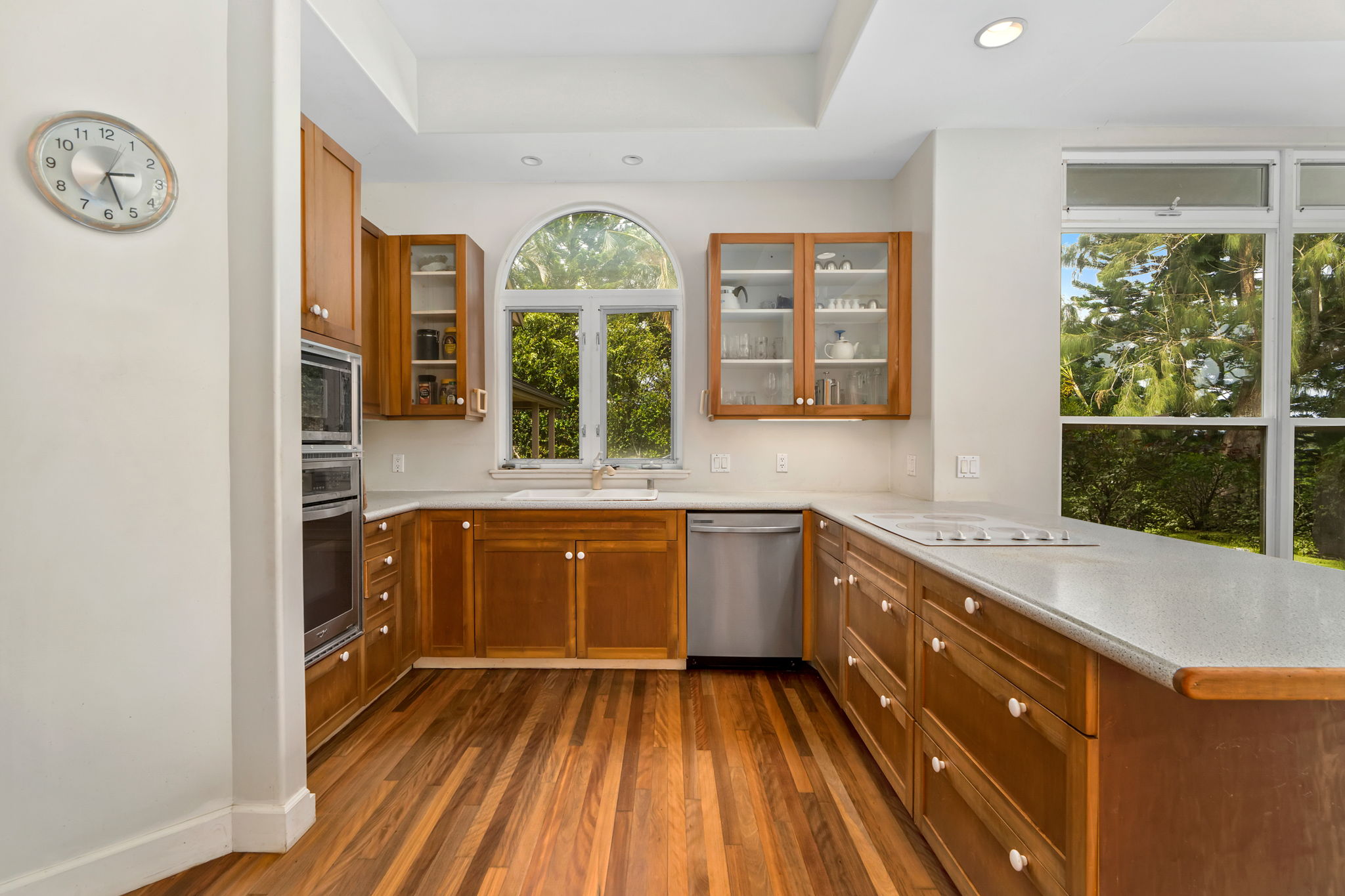 597 Puuopae Road Kapaa, HI 96746 - Photo 11 of 30 a spacious bathroom with a granite countertop tub a mirror and a window