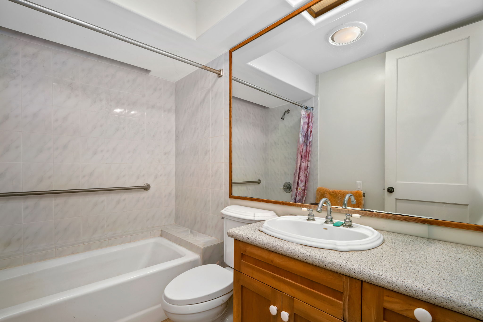 597 Puuopae Road Kapaa, HI 96746 - Photo 14 of 30 a bathroom with a granite countertop sink and a mirror