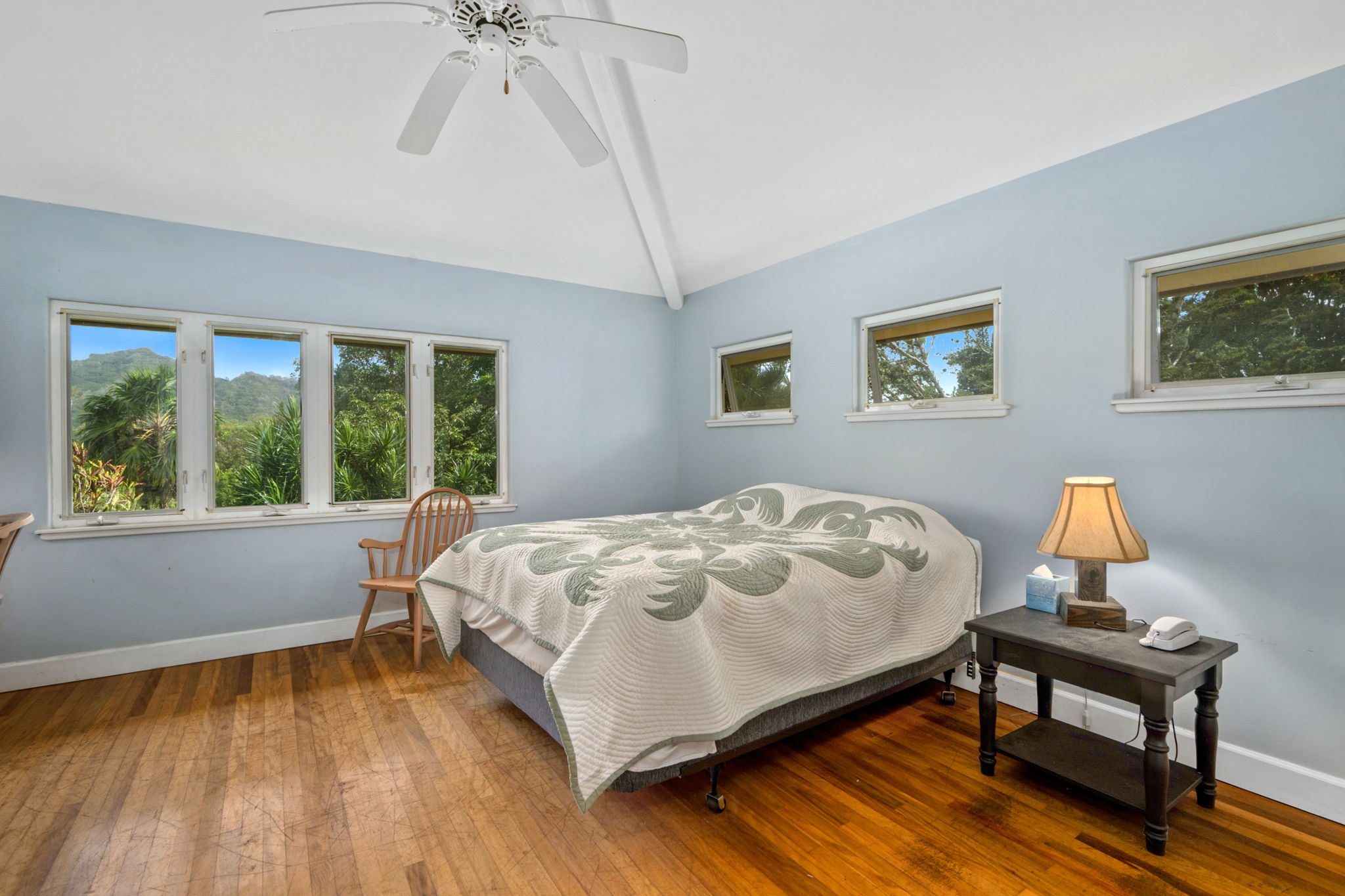 597 Puuopae Road Kapaa, HI 96746 - Photo 20 of 30 a bed sitting in a bedroom next to a window