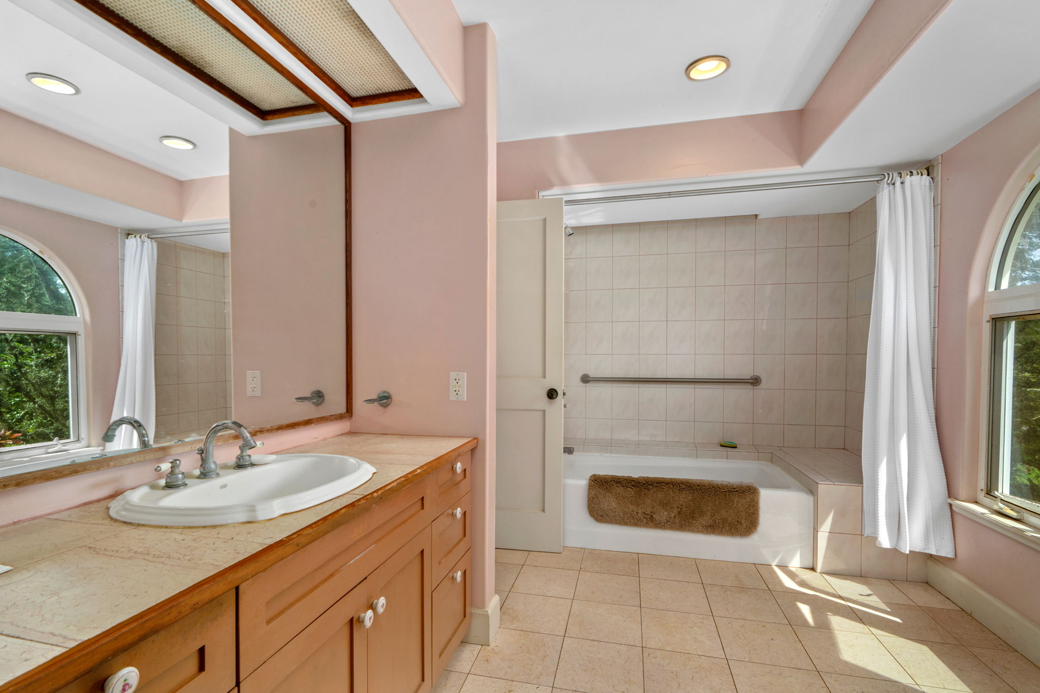 597 Puuopae Road Kapaa, HI 96746 - Photo 22 of 30 a bathroom with a sink and a mirror