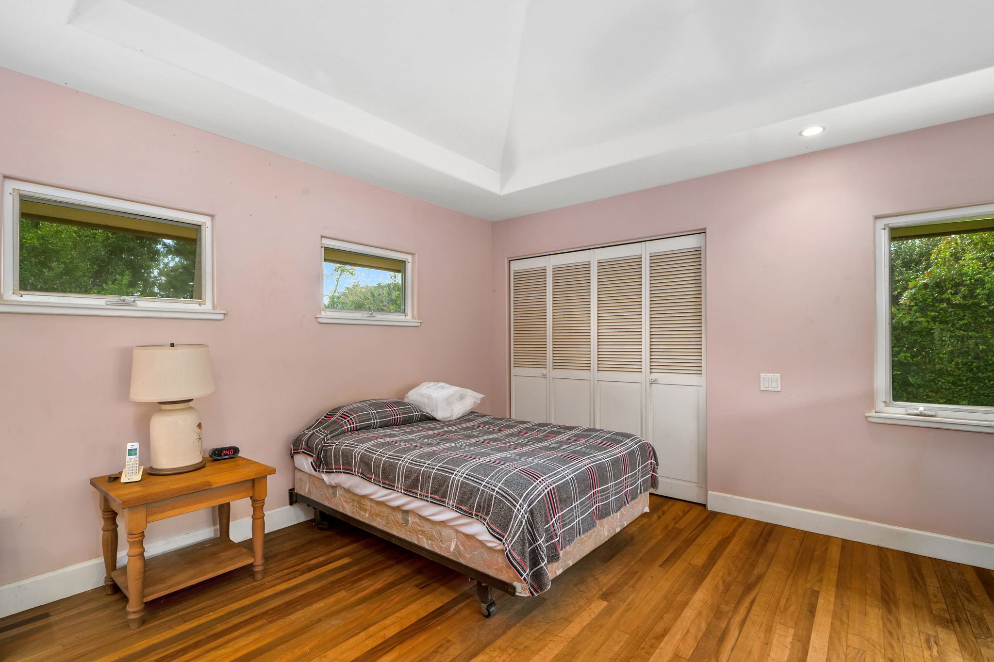 597 Puuopae Road Kapaa, HI 96746 - Photo 23 of 30 a bedroom with a bed and wooden floor