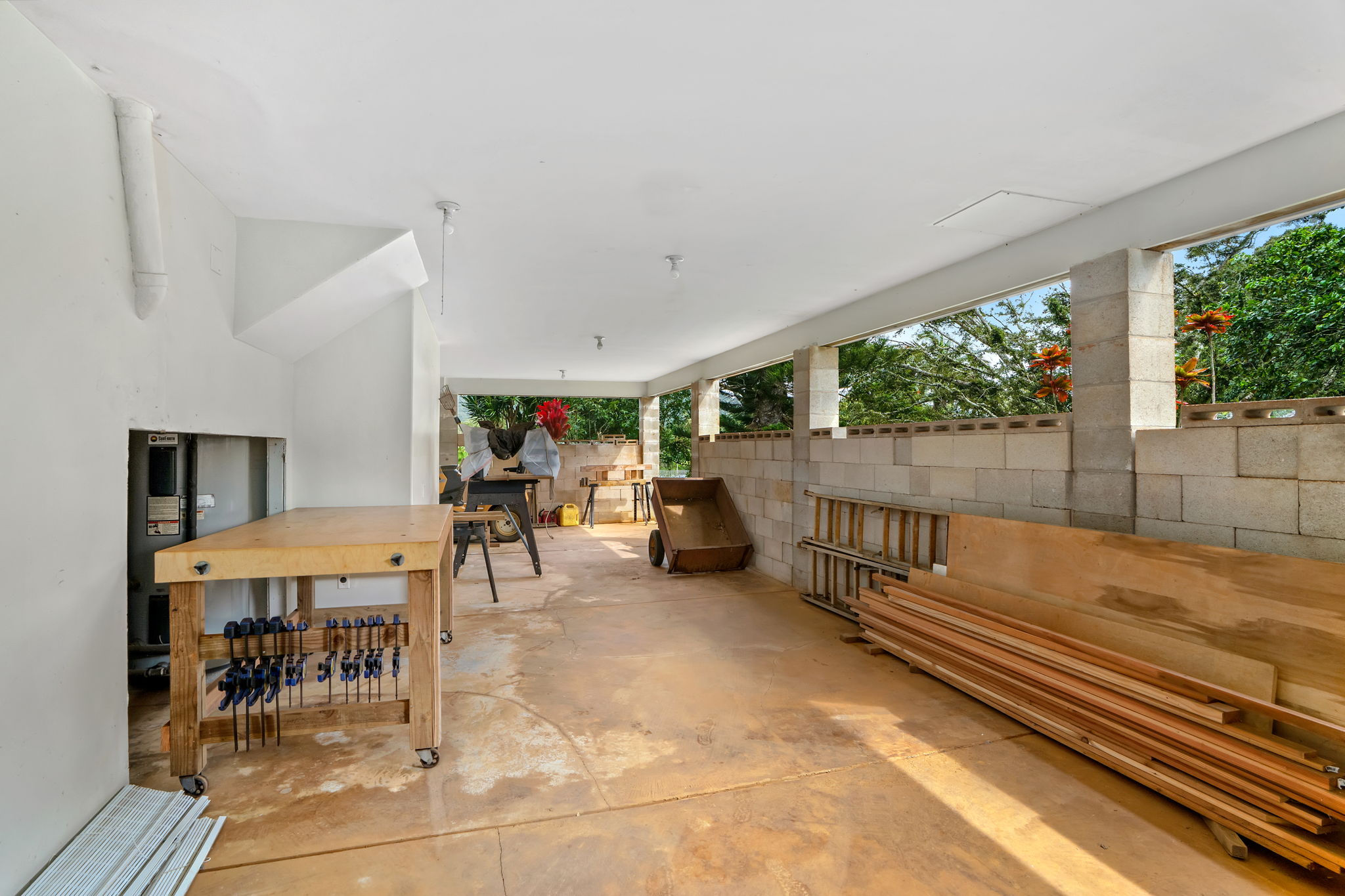 597 Puuopae Road Kapaa, HI 96746 - Photo 25 of 30 a view of a patio with table and chairs with wooden floor and fence