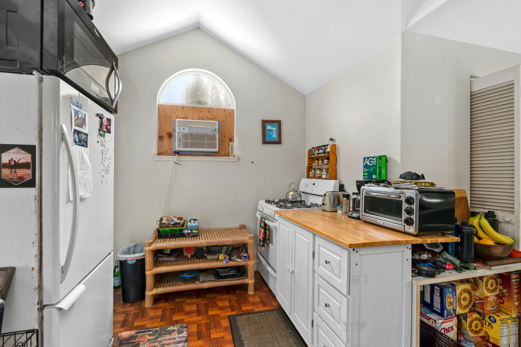 597 Puuopae Road Kapaa, HI 96746 - Photo 27 of 30 a kitchen with a sink appliances and cabinets