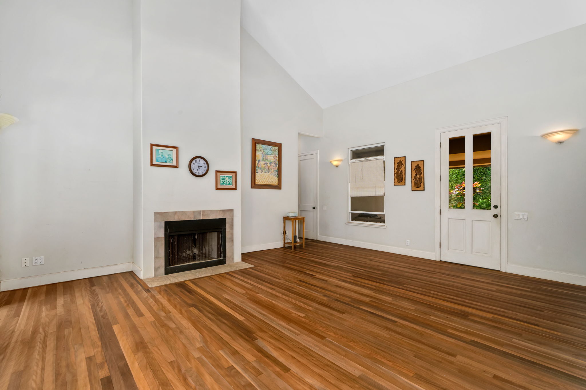 597 Puuopae Road Kapaa, HI 96746 - Photo 6 of 30 a view of empty room with wooden floor and fireplace