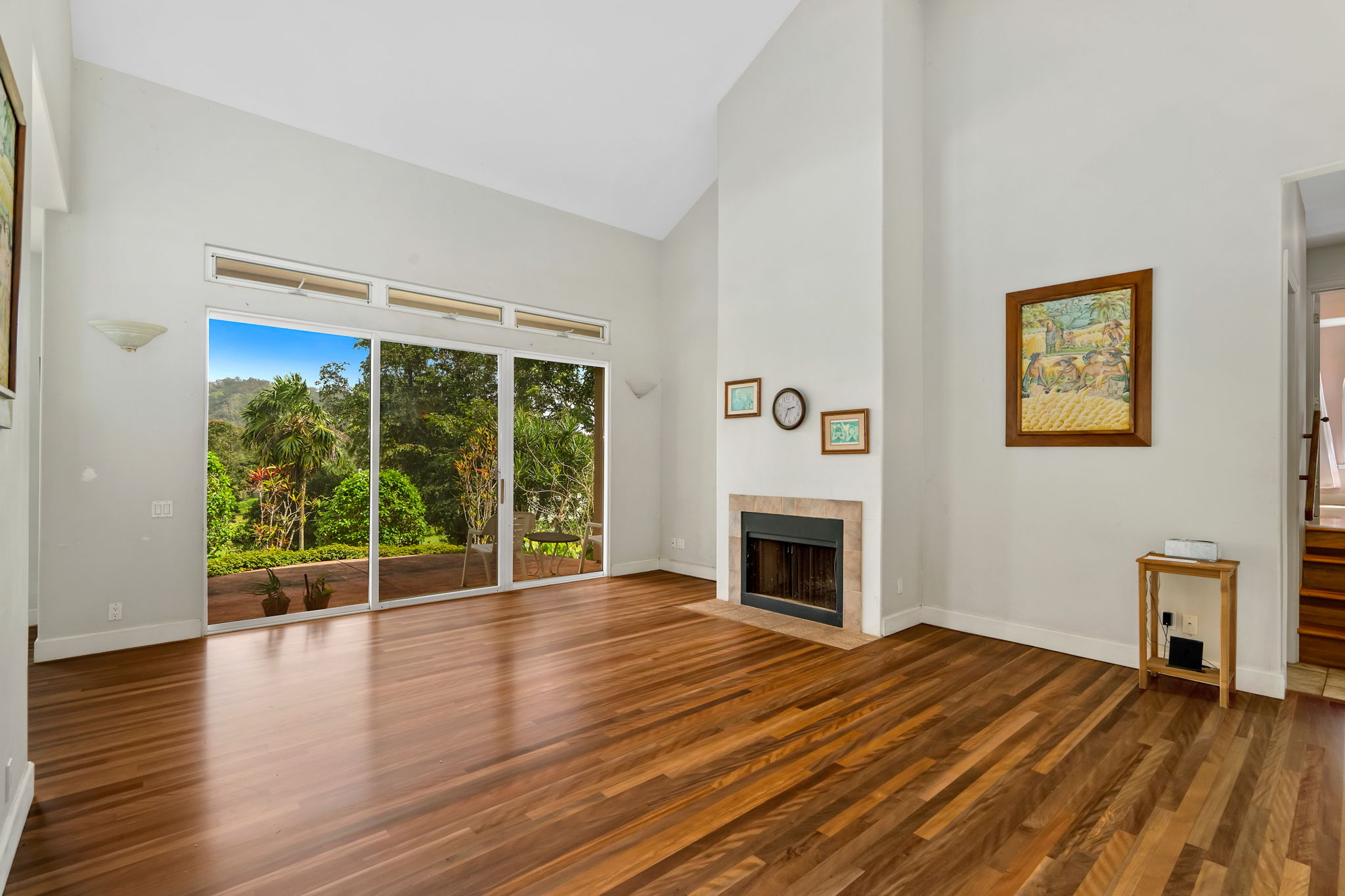 597 Puuopae Road Kapaa, HI 96746 - Photo 7 of 30 a view of empty room with wooden floor and fireplace