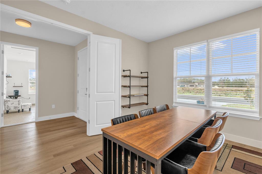 2008 River Hawk Loop Winter Haven, FL 33880 - Photo 15 of 37 a view of a dining room with furniture window and wooden floor