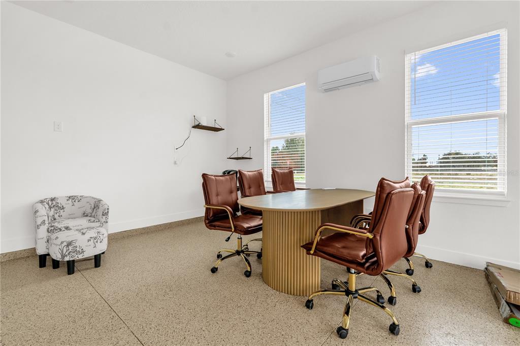 2008 River Hawk Loop Winter Haven, FL 33880 - Photo 18 of 37 a view of a workspace with furniture and a window