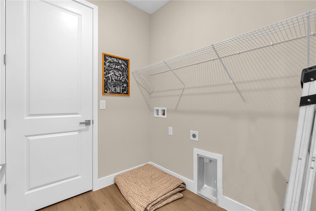 2008 River Hawk Loop Winter Haven, FL 33880 - Photo 20 of 37 a view of a hallway with wooden floor
