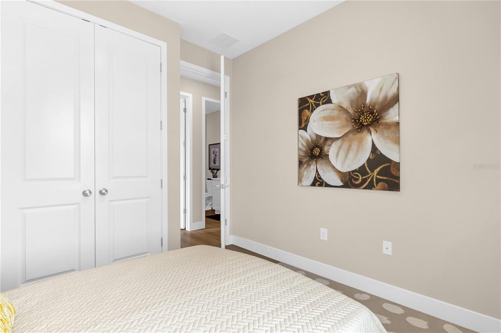 2008 River Hawk Loop Winter Haven, FL 33880 - Photo 24 of 37 a bedroom with a bed and painting on the wall