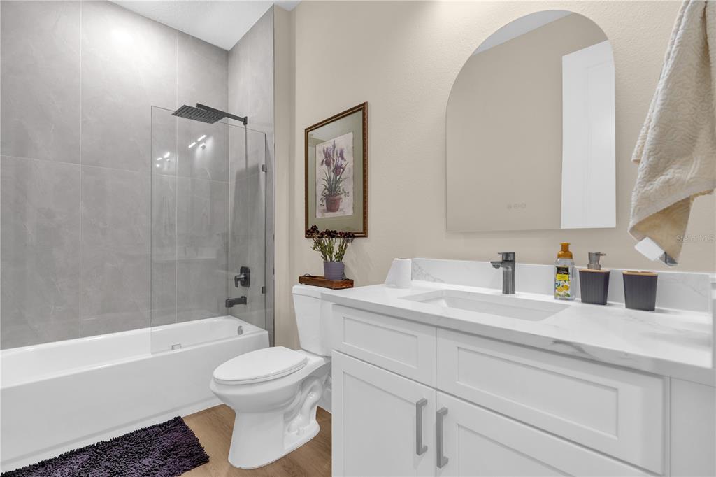 2008 River Hawk Loop Winter Haven, FL 33880 - Photo 25 of 37 a bathroom with a sink a toilet and a bathtub