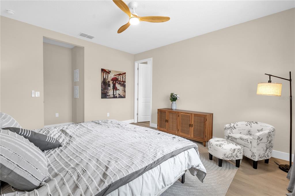 2008 River Hawk Loop Winter Haven, FL 33880 - Photo 29 of 37 a bedroom with a bed and wooden floor